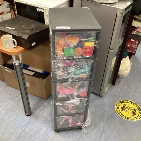 Multicoloured childrens toy storage rack with drawers.