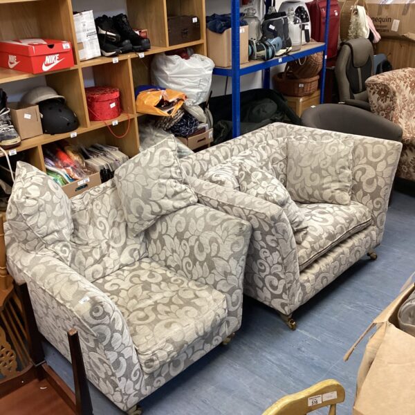 Grey patterned Sofology armchair set in a living room.