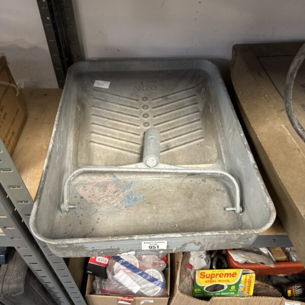 Large galvanised paint roller tray with roller head attachment.