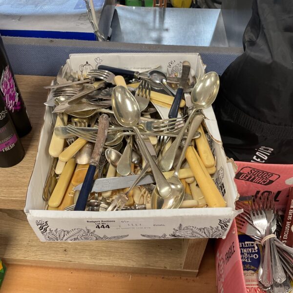 Mixed cutlery lot with stainless steel forks, knives and spoons.
