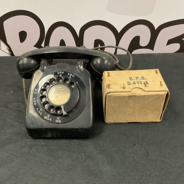 Vintage GPO rotary telephone with black bakelite casing.