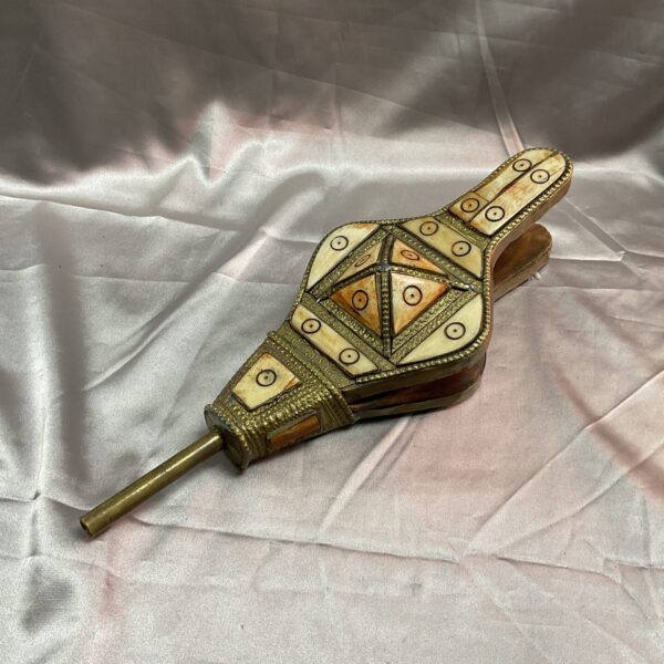 Intricate Moroccan camel bone bellows with brass detailing.