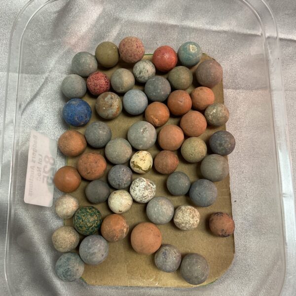 Close-up of a vintage stone marble collection, colourful and tactile.