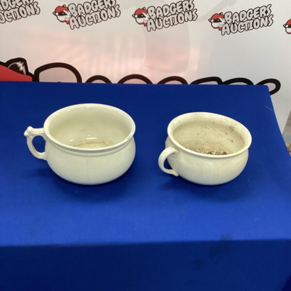 Pair of antique porcelain chamber pots for collectors.
