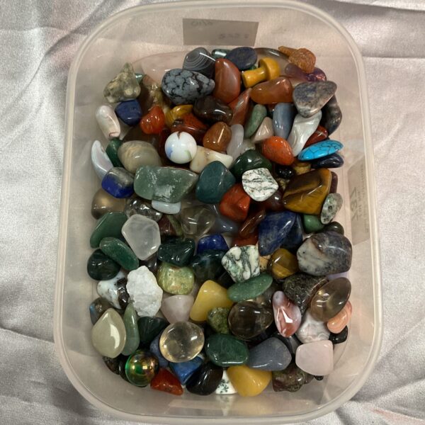 Colourful assortment of polished mineral stones for collectors.