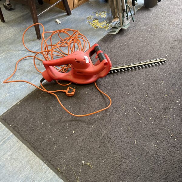 Champion electric hedge cutter for garden maintenance and landscaping.