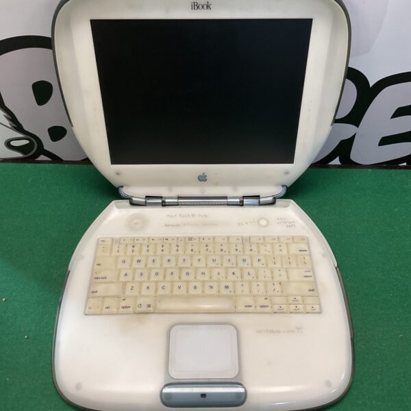 Vintage Apple iBook laptop, front view, clamshell design.