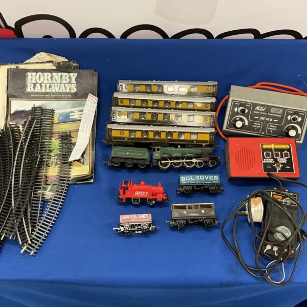 Vintage Hornby 00 gauge train set with carriages and power boxes.
