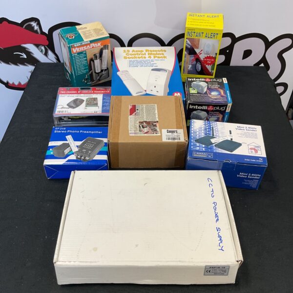 Smart home kit contents including remote control sockets and charger.