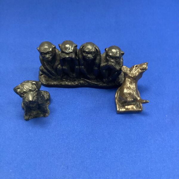 Vintage hear no evil monkeys sculpture with dog and mouse.