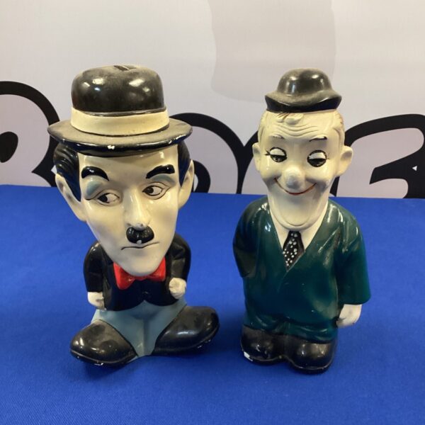 Vintage Charlie Chaplin and Laurel money box pair collectible figurine.
