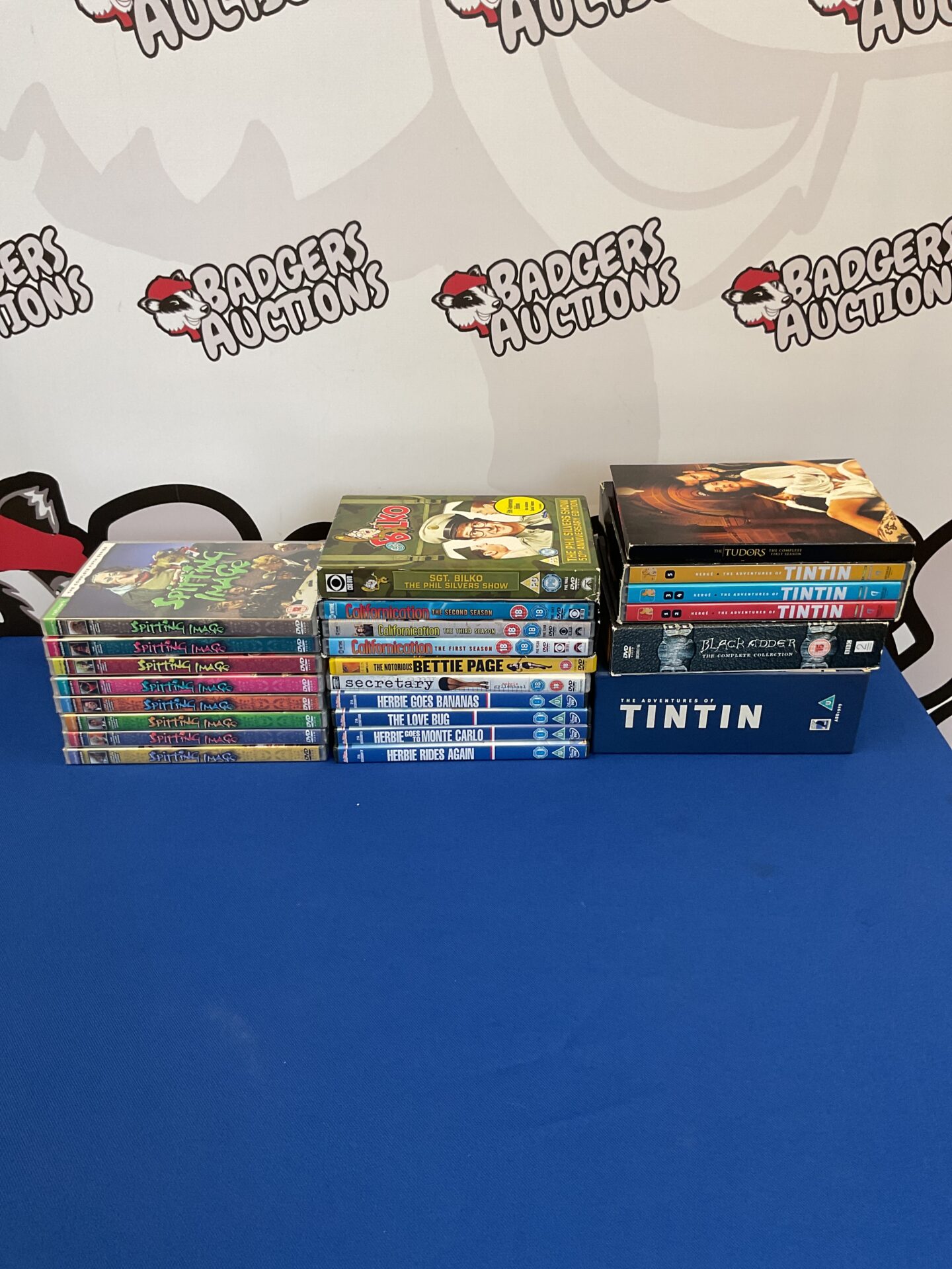079 Collection of DVDs including spitting image tin tin and black adder