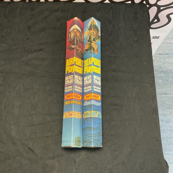 Vintage Matchbox playmats featuring airport and seaport designs.
