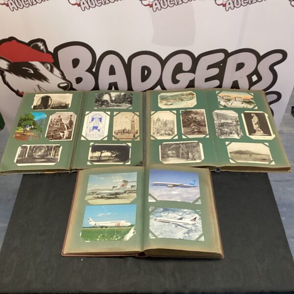 Vintage postcard albums with cloth covers, a collectible ephemera lot.