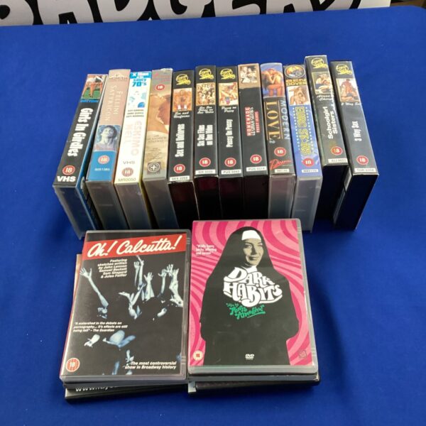 Collection of adult DVDs and VHS tapes for collectors.