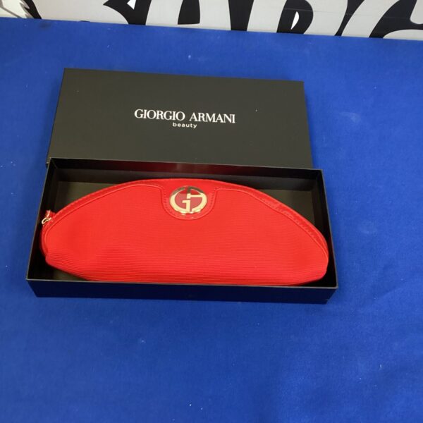 Front view of a black Giorgio Armani clutch bag.