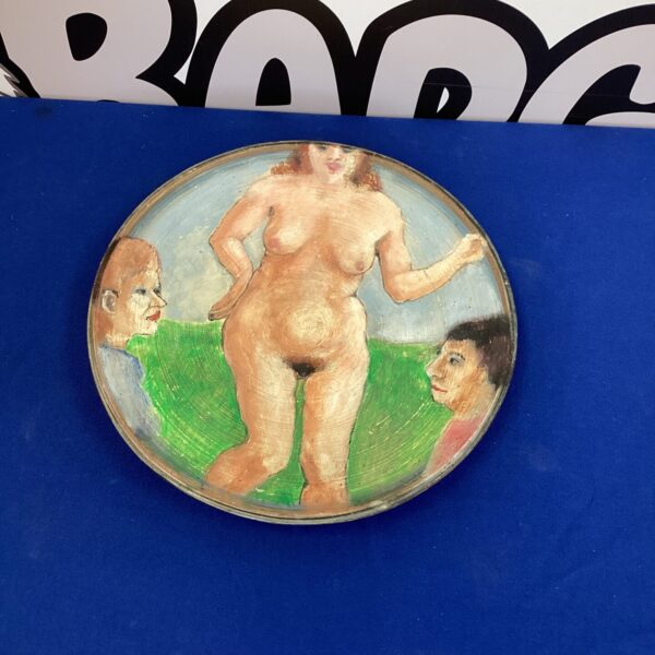 Vintage studio pottery plate with nude lady artwork.