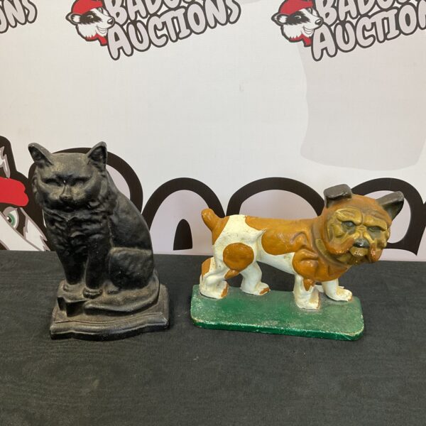 Vintage cast iron cat and dog doorstops for antique home decor.