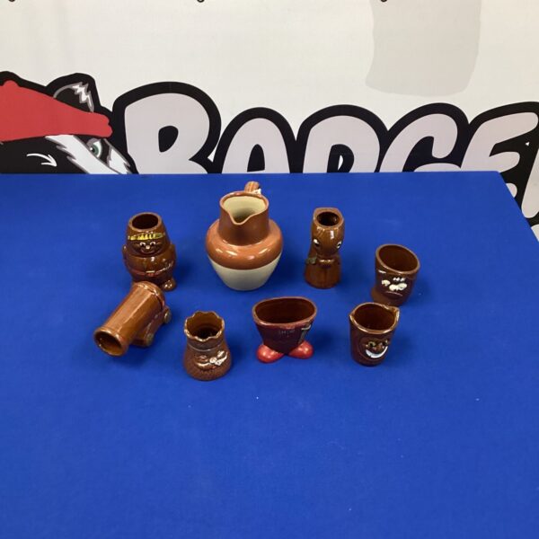 Vintage Japanese sake set with bottle, cup, and serving vessel.