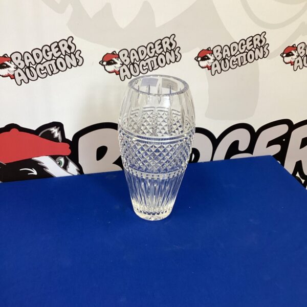 Intricate cut glass crystal vase, elegant home decor.