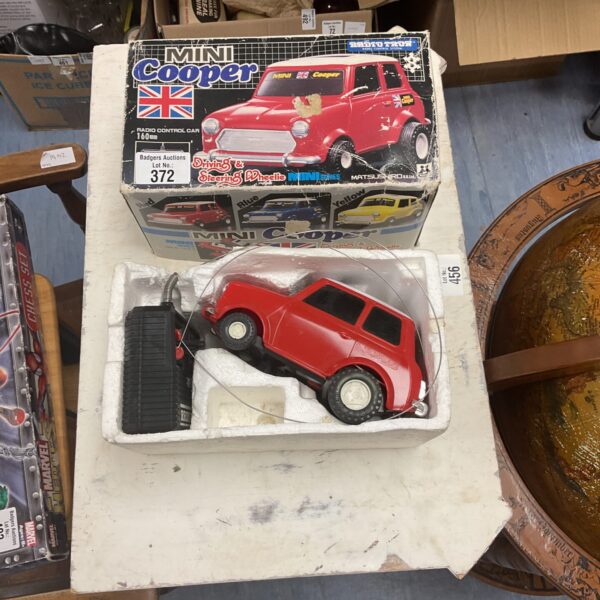 Vintage red RC Mini Cooper remote control car.