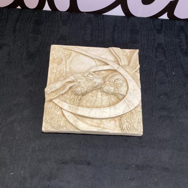 Detailed Cotswold Marble Plaque featuring kissing hares.
