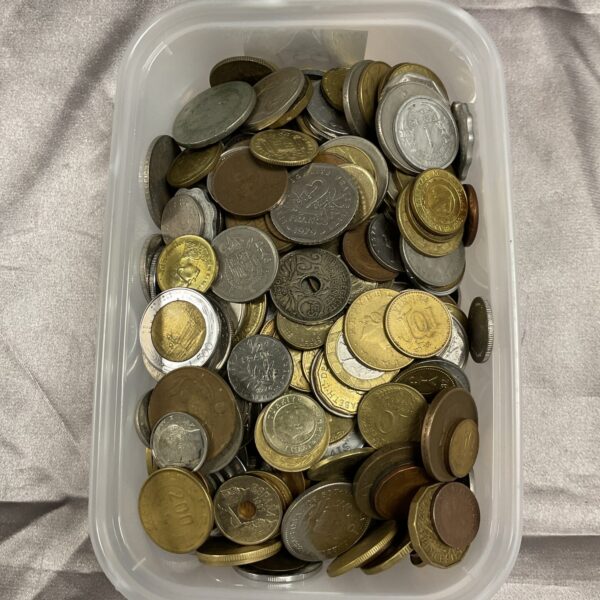 Mixed coin lot in a clear tub for collectors.