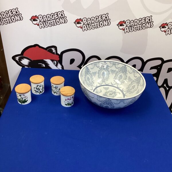 Vintage Portmeirion spice jars and mixing bowl set on a white surface.