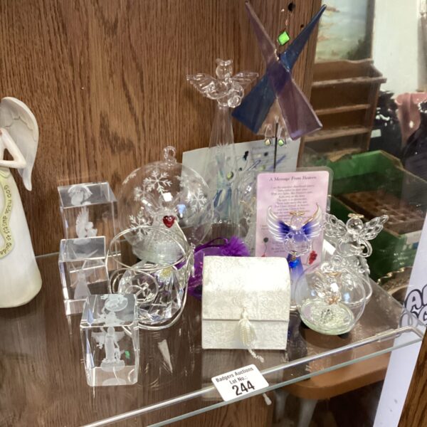 Selection of delicate glass angel ornaments for collectors.
