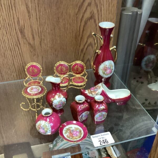 Delicate miniature Imoges porcelain pieces with floral designs.