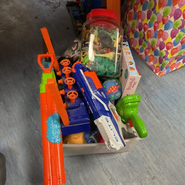 Nerf Elite Disruptor blaster with dinosaur figures and mousepad.