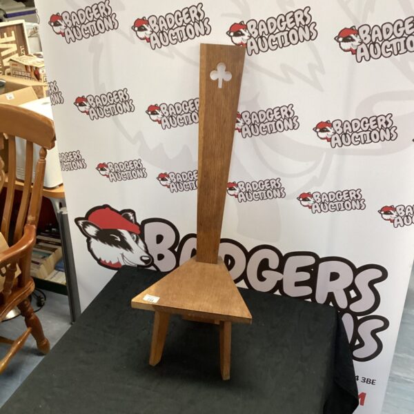 Vintage oak spinning chair with curved spokes and a worn finish.