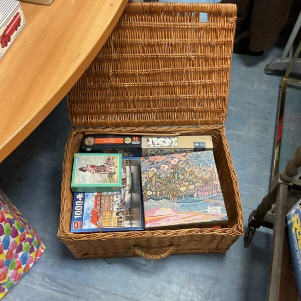 Mixed puzzle lot in a wicker basket, vintage jigsaw puzzles.