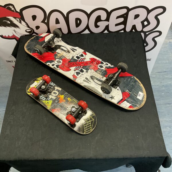 Two used skateboards with skull design, ideal for street skating.
