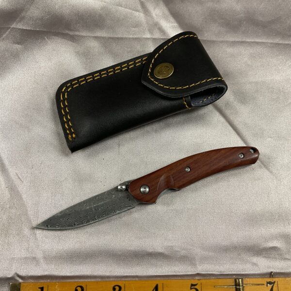 Damask pocket knife with leather sheath, collectible folding knife.