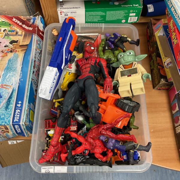 Mixed toy lot with diecast models and figurines for collectors.
