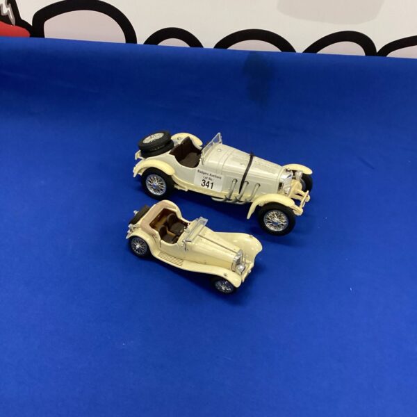 Vintage Mercedes Benz SL and Jaguar model cars for collectors.