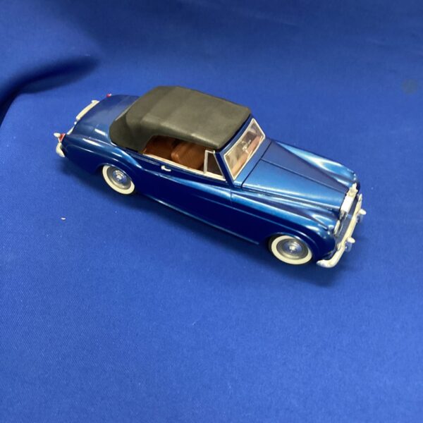 Blue vintage model Rolls Royce car, detailed collectible.
