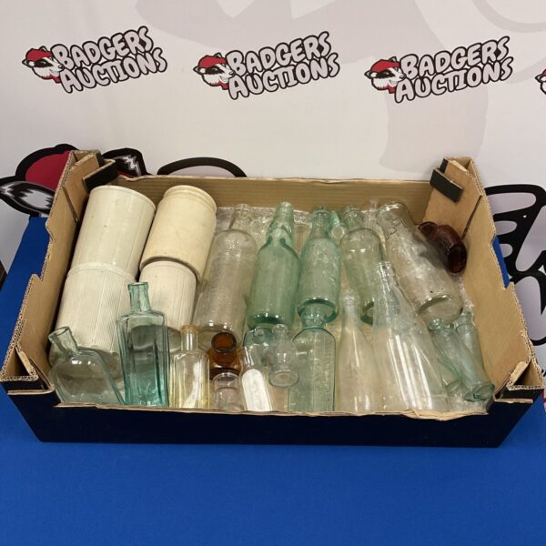 Antique glass bottle collection with colourful vintage bottles.