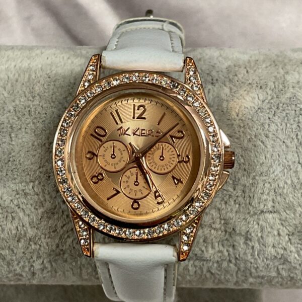 Stylish ladies quartz wristwatch by Tickers with white leather strap.