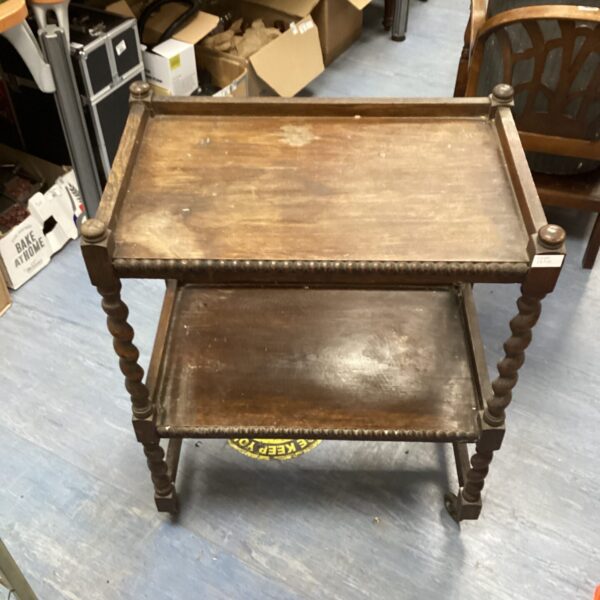 Vintage mahogany butlers trolley with two tiers and castors.