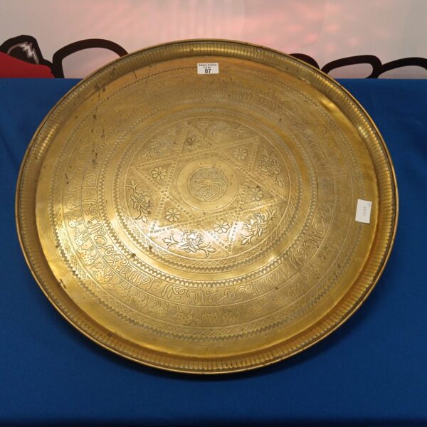 Large antique Islamic brass charger tray with intricate designs.