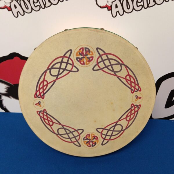 Front view of a traditional Irish bodhran drum with Celtic design.