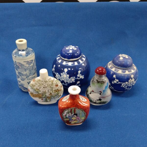 Collection of miniature Chinese ginger jars and scent bottles.