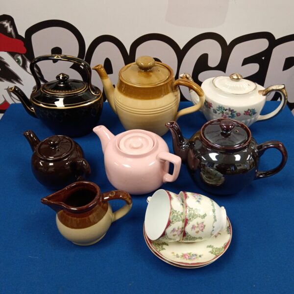 Vintage teapot collection with various colours and styles.