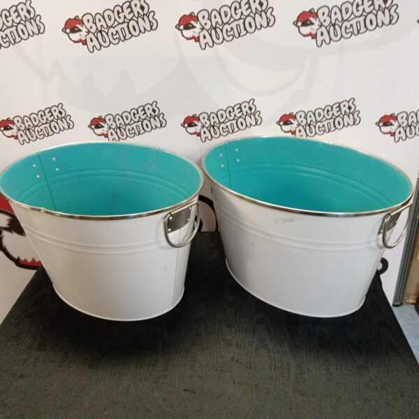 Two vintage tin beverage tubs with handles, ideal for serving drinks.