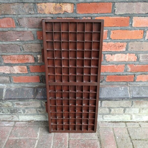 Vintage metal printers block tray for letterpress typography.