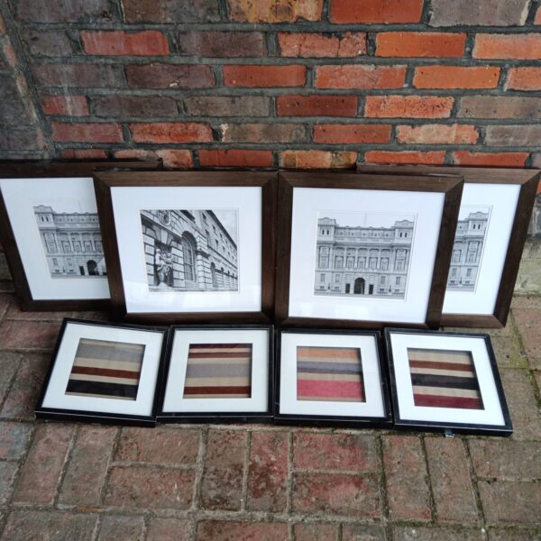 Set of eight framed London photo prints with striped fabric accents.