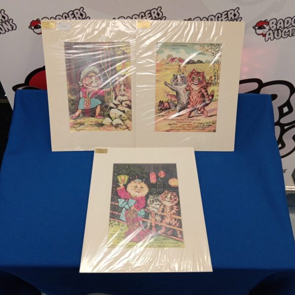Vintage Louis Wain cat prints depicting comical feline scenes.