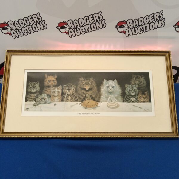 Framed Louis Wain print depicting cats at a table.